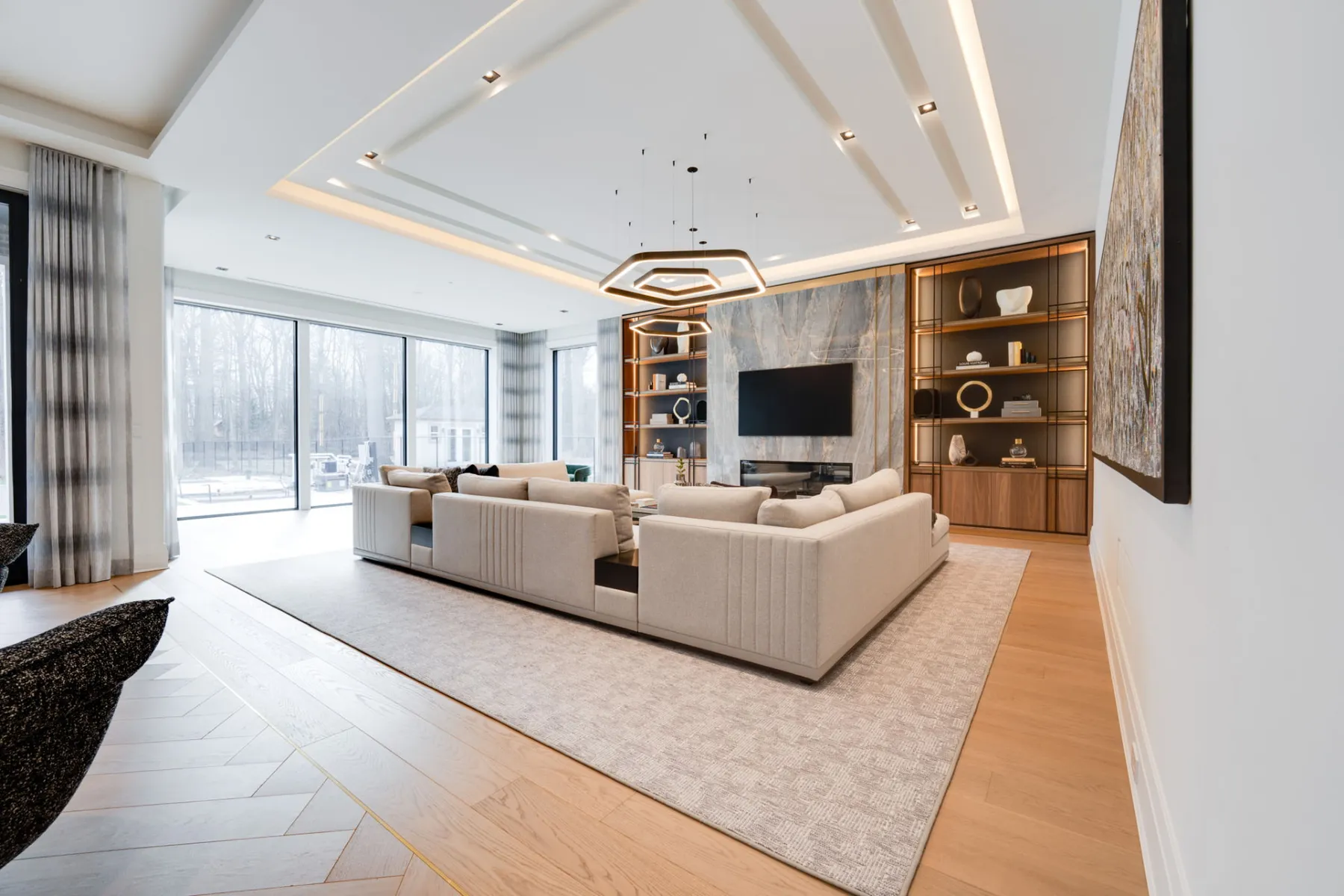 Family room with oversized sectional and hexagon light fixtures